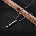 Close-up of a silver polished whistle pendant on a box chain for men and women - XL14 / Whistle / Silver