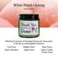 Αρωματικό κερί σόγιας White Peach Oolong σε πράσινο γυάλινο βάζο με μαύρο καπάκι - Λευκό ροδάκινο Oolong / Σκούρο Πράσινο