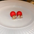 Macro view of Chinese New Year earrings with red beads and golden 'Fa' and 'Cai' charms - Red Fortune Character Style