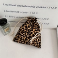 Close-up of leopard print velvet drawstring pouch with thick cotton cord detail - Small Leopard Brown Yellow