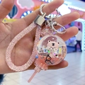 Detailed view of pink tiger keychain with floating glitter and liquid in crystal ball - Lollipop