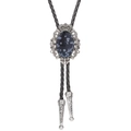 Detail of crown motif bolo tie with snowflake obsidian stone and braided leather cord - Black Zebra Agate