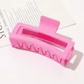 Close-up of a large matte pink rectangular hair claw clip on a minimalist paper background - 13cm Rectangular - Matte Girly Pink