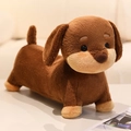 Soft dark brown dachshund plush dog toy standing on a white table with a warm home vibe - Brown Crystal Super Soft / 28cm