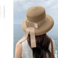 Detail of khaki straw sun hat with beige ribbon against a scenic ocean background - M (56-58cm) / Light Coffee