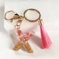 Pink resin letter X keychain with gold flakes and a matching tassel pendant accessory - Letter X