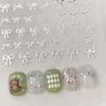 Silver bow nail stickers YO-010 featuring hollow metallic designs for manicure art - YO-010 Silver