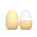 Detail view of yellow silicone ice roller with spiral texture for facial skincare therapy - New Egg Yellow