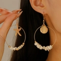 Detail of asymmetrical ocean hoop earrings with starfish and shell charms on a model - Starfish Scallop Crushed Stone Hoop Earrings (DZ-587)
