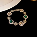 Vintage gold bracelet with emerald and amber stones surrounded by fine zircons - Gold-Green Grey
