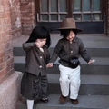Retro grey tweed jacket set with skirt and sun hat for children on outdoor stairs - Coffee