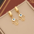 Macro shot of gold Hamsa hand earrings with blue evil eye bead on a beige jewelry box - Hamsa Hand Eye (5#)