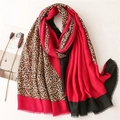 Detail of pink and black patchwork scarf featuring leopard print and frayed edges - Rose Red