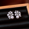 Macro shot of vintage pearl cluster earrings with small diamonds on black velvet - Clustered Pearl Rhinestone Style (50#)