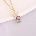 Detail of 18K gold letter E pendant with crown and multicolored cubic zirconia stones - Letter E Style