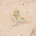 Macro shot of gold snake ring with light green enamel scales and sparkling crystals - Light Blue