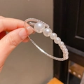 Detailed close-up of a silver multi-layer pearl bracelet with sparkling crystal accents - 20# Bracelet-Silver