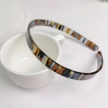 Schmaler Haarreif aus Acetat mit klassischem Schildpattmuster in Schwarz- und Orangetönen - Camouflage