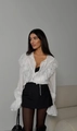 Close-up of white French V-neck lace edges and elegant ruffle trim on blouse sleeve - S / White