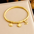 Detailed view of gold bangle with sea-themed charms including shell, fish and anchor - Nautical Series Shell Tropical Fish Anchor (B1631)