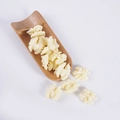 Realistic cream white walnut-shaped PVC grains displayed with a natural bamboo shovel - White Walnut Kernels (500g)