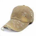 Detailed view of the distressed edge and torn fabric on the khaki cotton baseball cap - Adjustable / Khaki