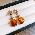 Macro shot of retro brown resin beads and gold textured knots on luxury drop earrings - Woven Knot Irregular Drop (82#) / Amber Gold
