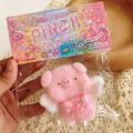 Pink pig stress toy with wings in sealed bag packaging with hanging chain - Angel Pig