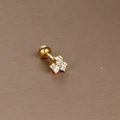 Detail of gold cartilage stud featuring three white zircons and a secure screw ball back - Gold White Zirconia (Three-Stone Cluster)