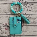 Detail of teal PU leather ID card holder with matching silicone bead bracelet and tassel - Light Green