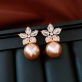 Detail of 18K gold plated flower stud earrings with shimmering champagne pearls and zircons - Pink Orange Pearl Flower Earrings