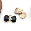 Golden alloy bow charm with black enamel and central rhinestone for DIY jewelry - Rhinestone Bow Tie (11923)