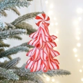 Red and white candy cane star ornament hanging on a snowy Christmas tree branch - Red Series - Candy Ball Topper