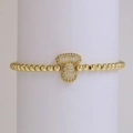 18k gold plated bubble bead bracelet with a crystal mushroom charm on a display stand - Letter T