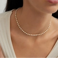 Minimalist freshwater pearl choker necklace with gold beads worn by a model - White Pearl and Gold Bead Interval Style (W-d-016)