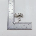 Silver bow pendant with micro-pave zircons measured at 22mm width on a ruler - Full Zirconia Bow / Silver