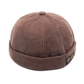 Detailed view of the brown corduroy fabric texture and stitched label on the docker hat - M (56-58cm) / Coffee