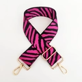 Detail of pink and black zebra print bag strap with golden metal swivel hooks - Rose Red Zebra Print / Gold Buckle