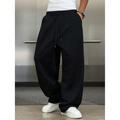 Men's American retro loose black sweatpants featuring a drawstring waist and wide-leg fit - Black