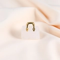 Detailed view of mini white crystal handbag pendant with gold handle on beige fabric - White Crystal