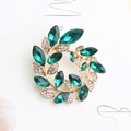 Elegant gold-tone wreath brooch featuring emerald green crystals and sparkling rhinestones - Green (Gold Base/Emerald Wreath)
