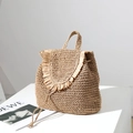 Handwoven straw backpack in khaki with decorative tassels for beach and leisure style - Brown