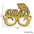 Golden glitter GRAD graduation glasses frame with mortarboard and dimension 17x13cm - Style I (Large Gold Grad)