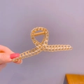 Elegant gold metal hair claw clip with double-row chain link design in a glossy finish - Gold Hollow Figure-8 Cross Claw