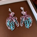 Detailed view of goldfish drop earrings with colorful crystals and vintage silver finish - Pink Blue Goldfish Style