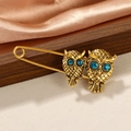 Vintage gold owl brooch with blue rhinestone eyes on safety pin base for women - Vintage Safety Pin Double Owl Blue Rhinestone Eye