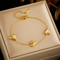 Gold plated stainless steel chain bracelet featuring three 3D heart-shaped pendants - Heart Pendant Bracelet (B1279)