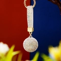 Detail of a sparkling crystal-studded ball keychain with white leather strap on metal ring - Single OPP Bag Packaging / AB Color