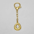 Polished 18k gold plated alphabet keychain featuring a teardrop-shaped metal pendant - Letter O