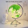 Modern transparent green globe with 2m LED firefly lights and silver metal tripod base - Globe - Green + Light String